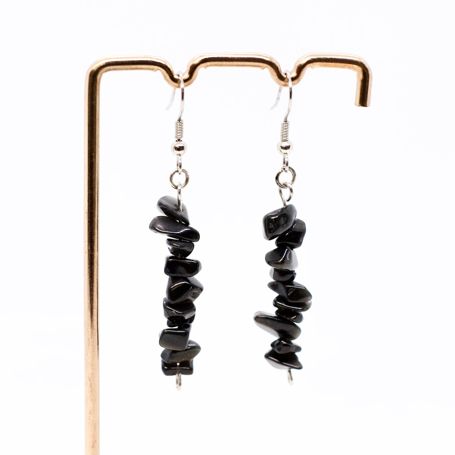 obsidian gemstone earrings on display stand with silver earring hooks