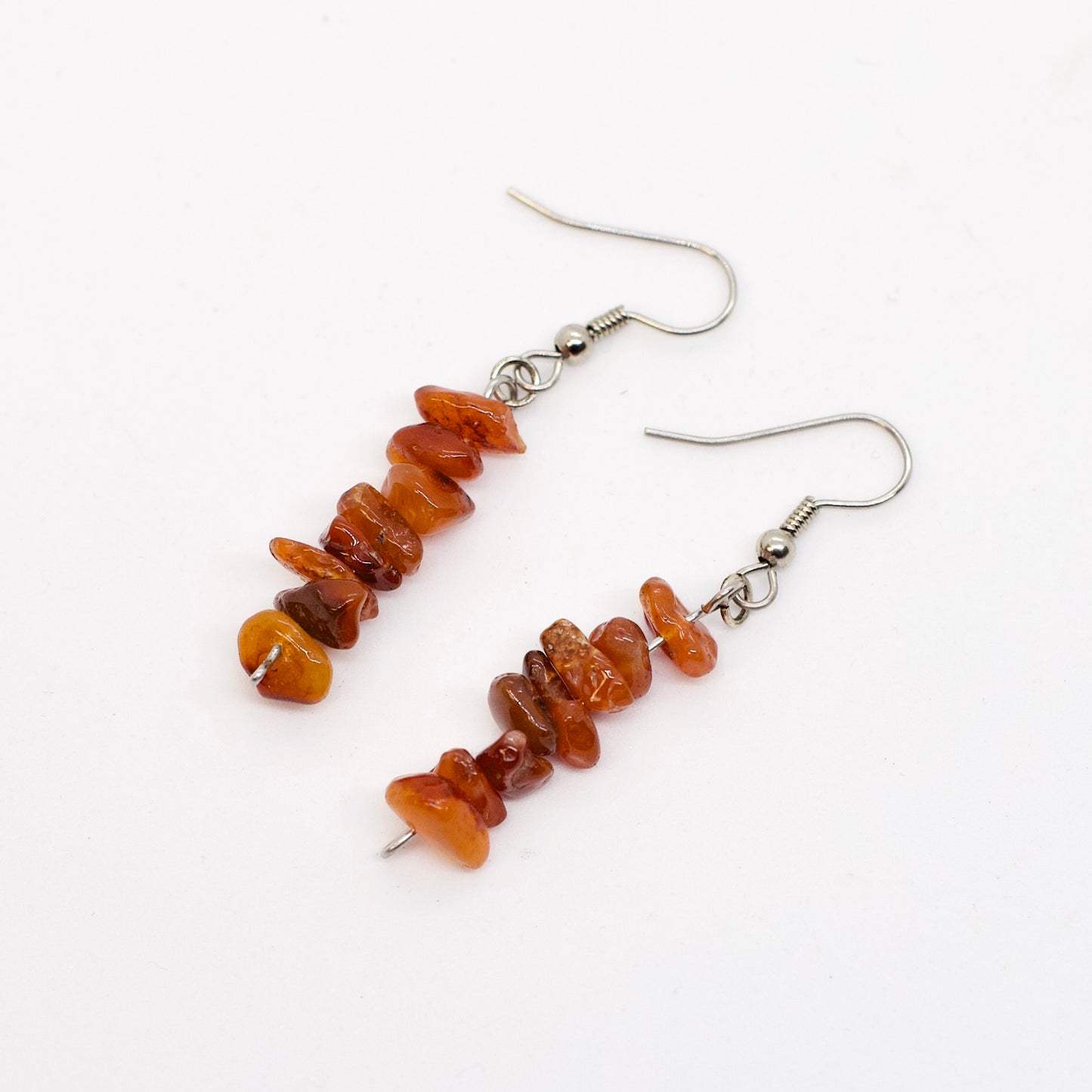Carnelian Gemstone chip dangle earrings on white background