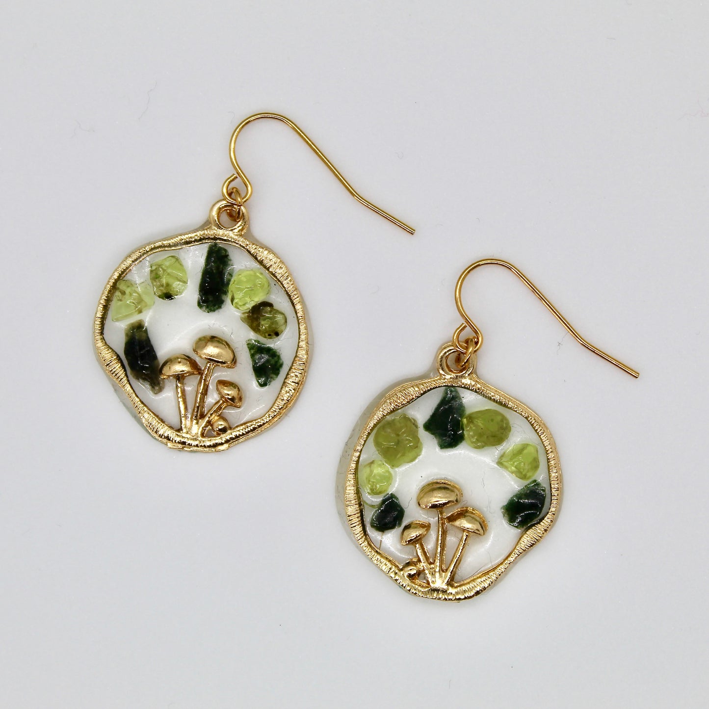 gold mushroom earrings with moss agate and peridot crystal gemstone chips on white background