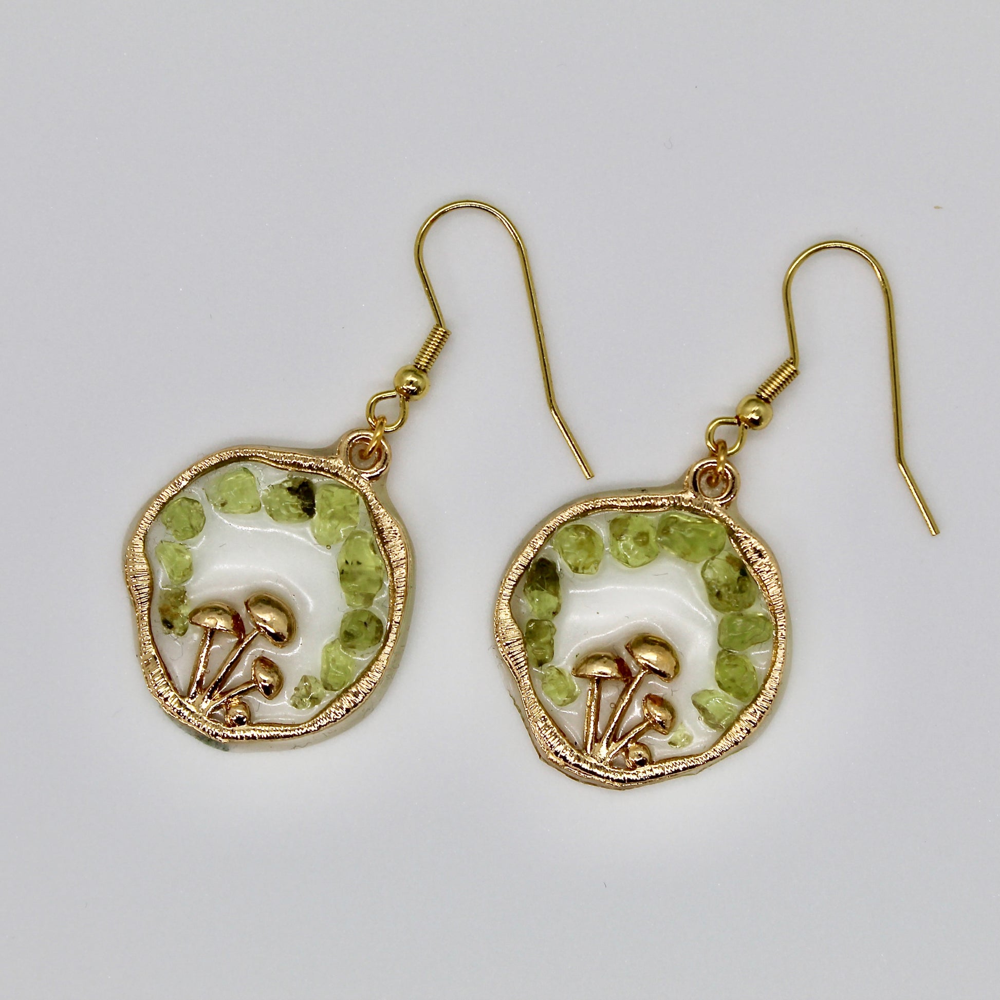 peridot gemstone mushroom earrings on white background