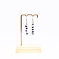 Howlite and Sodalite gemstone chip earrings on display stand 