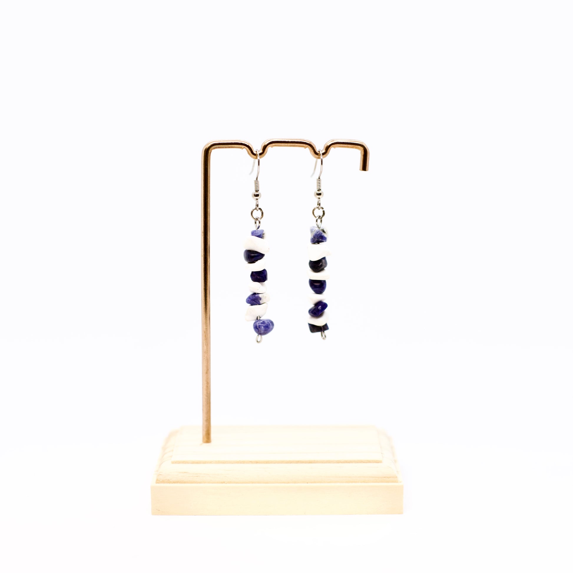 Howlite and Sodalite gemstone chip earrings on display stand 