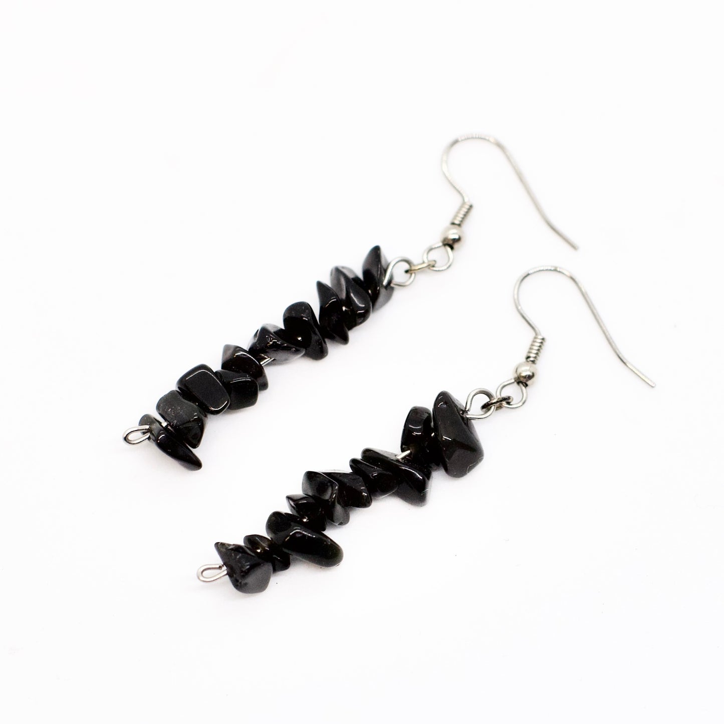 Black obsidian gemstone chip earrings on white background 