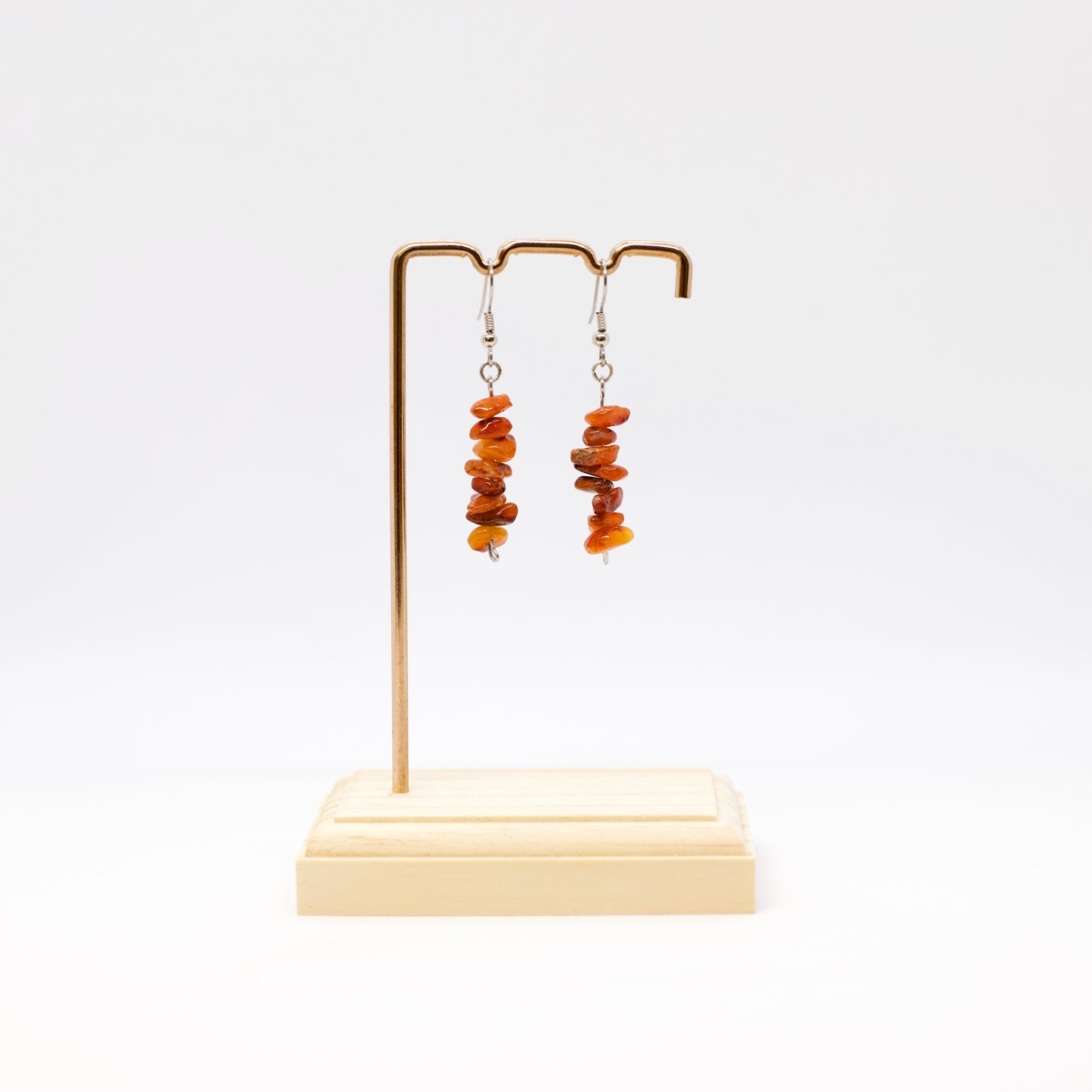 Carnelian Gemstone chip Earrings on display stand with white background
