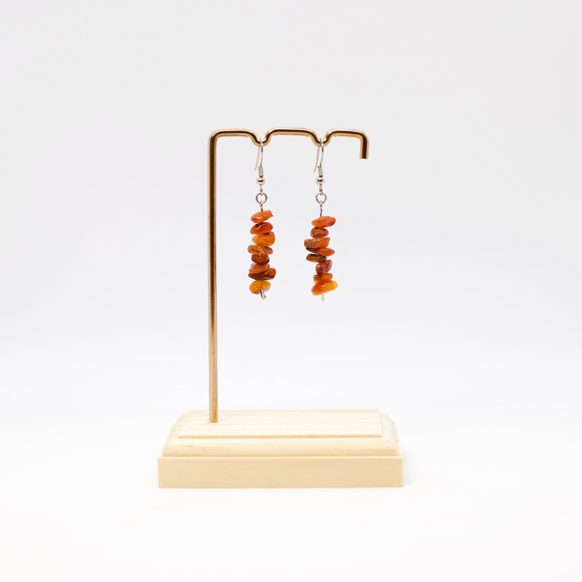 Carnelian Gemstone chip Earrings on display stand with white background