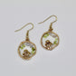 blue lace agate and peridot gemstone mushroom gold earrings on white background 