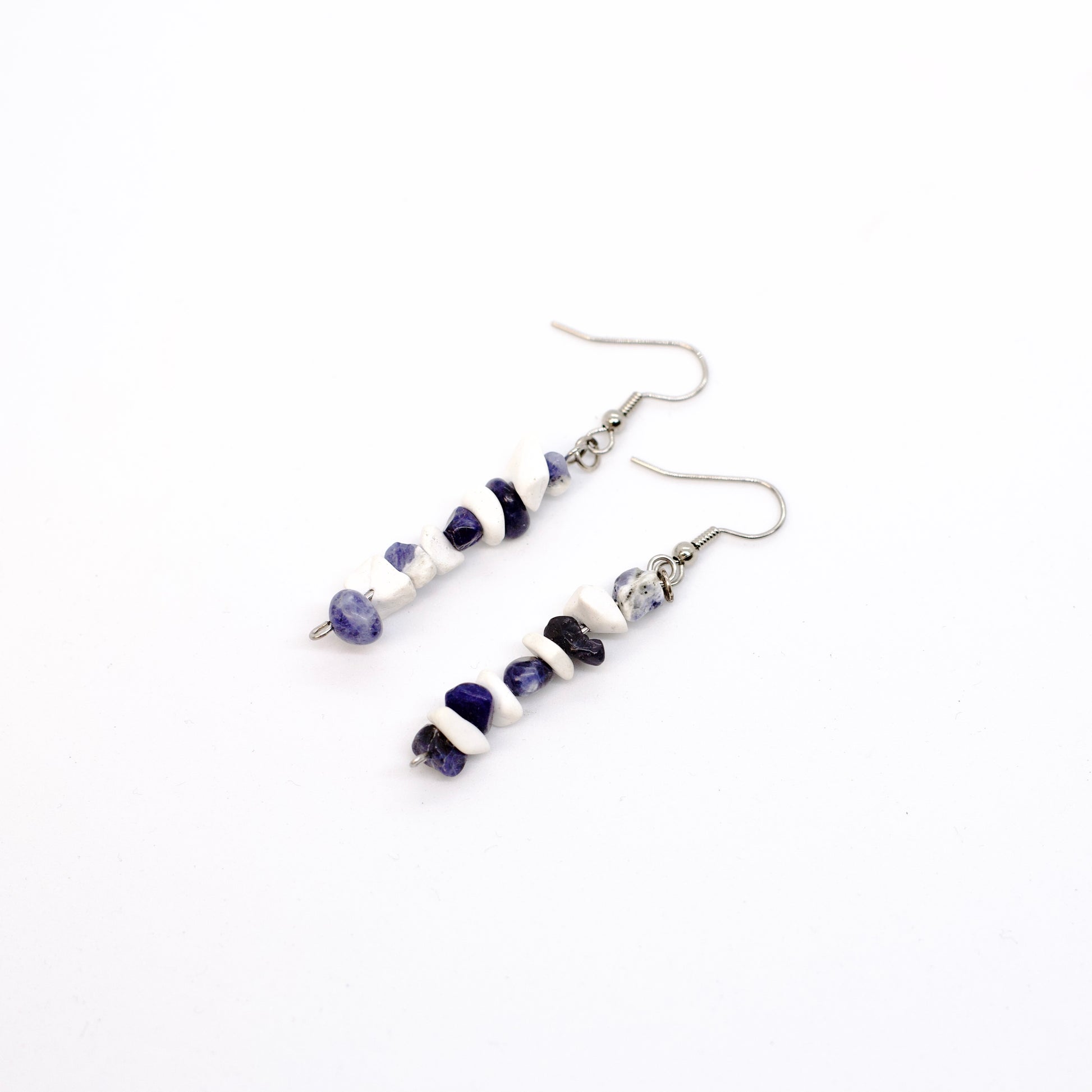 howlite and sodalite gemstone earrings on white background 