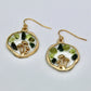 gold mushroom earrings with peridot and moss agate gemstone chips on white background 