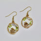 peridot and blue lace agate gemstone gold mushroom earrings on white background 