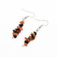 closeup of Carnelian and Obsidian gemstone chip dangle earrings on white background
