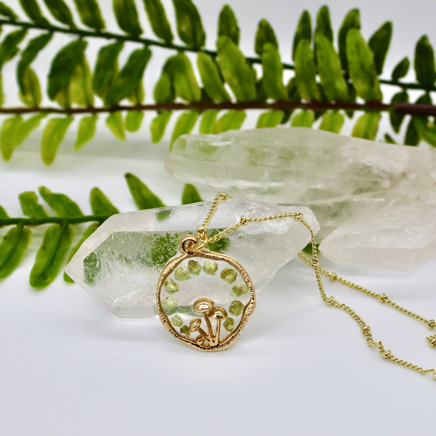 gold mushroom necklace with green gemstone chips 