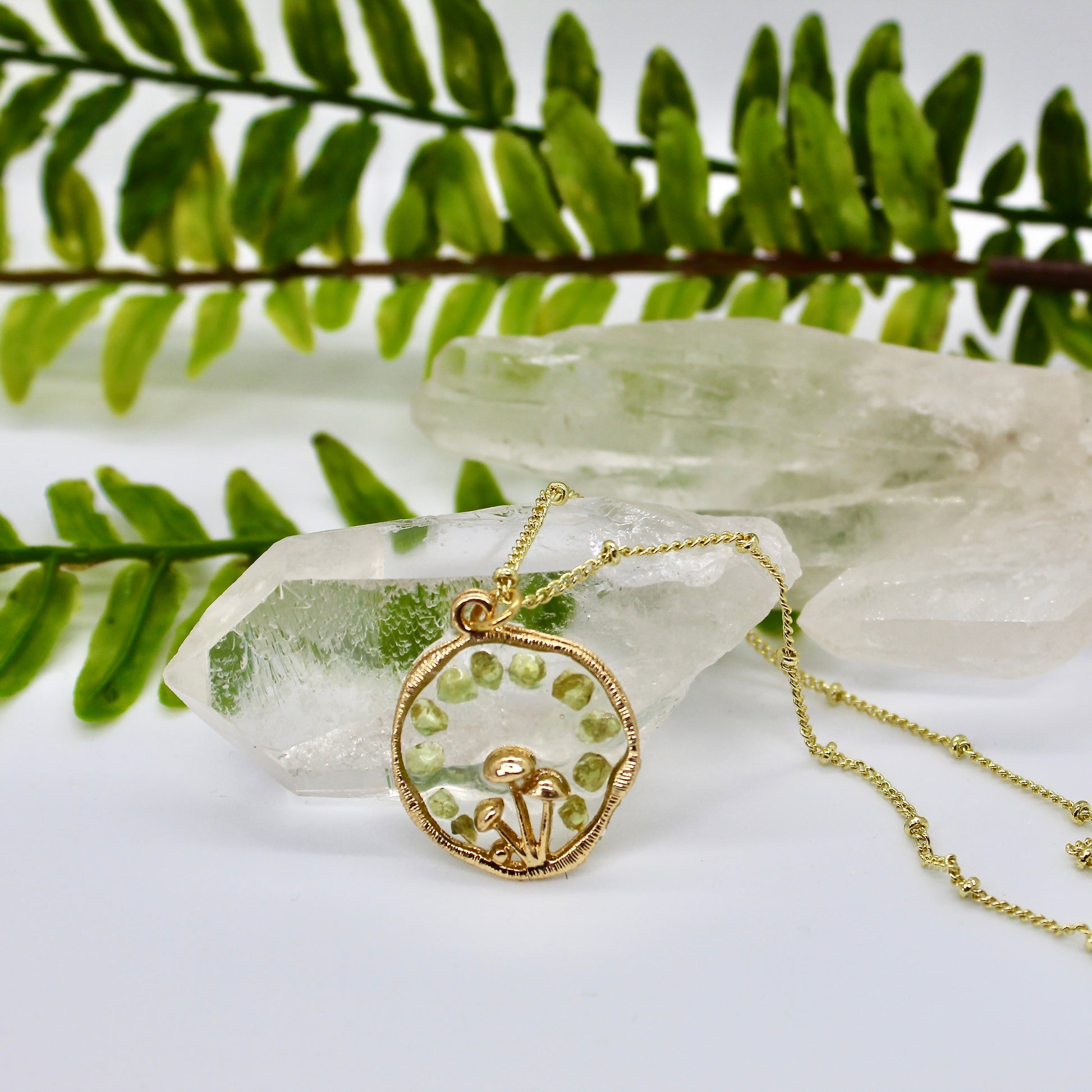 gold mushroom necklace with green gemstone chips 