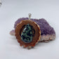 Sideview of pinecone pendant with Kambaba jasper gemstone and silver bail 