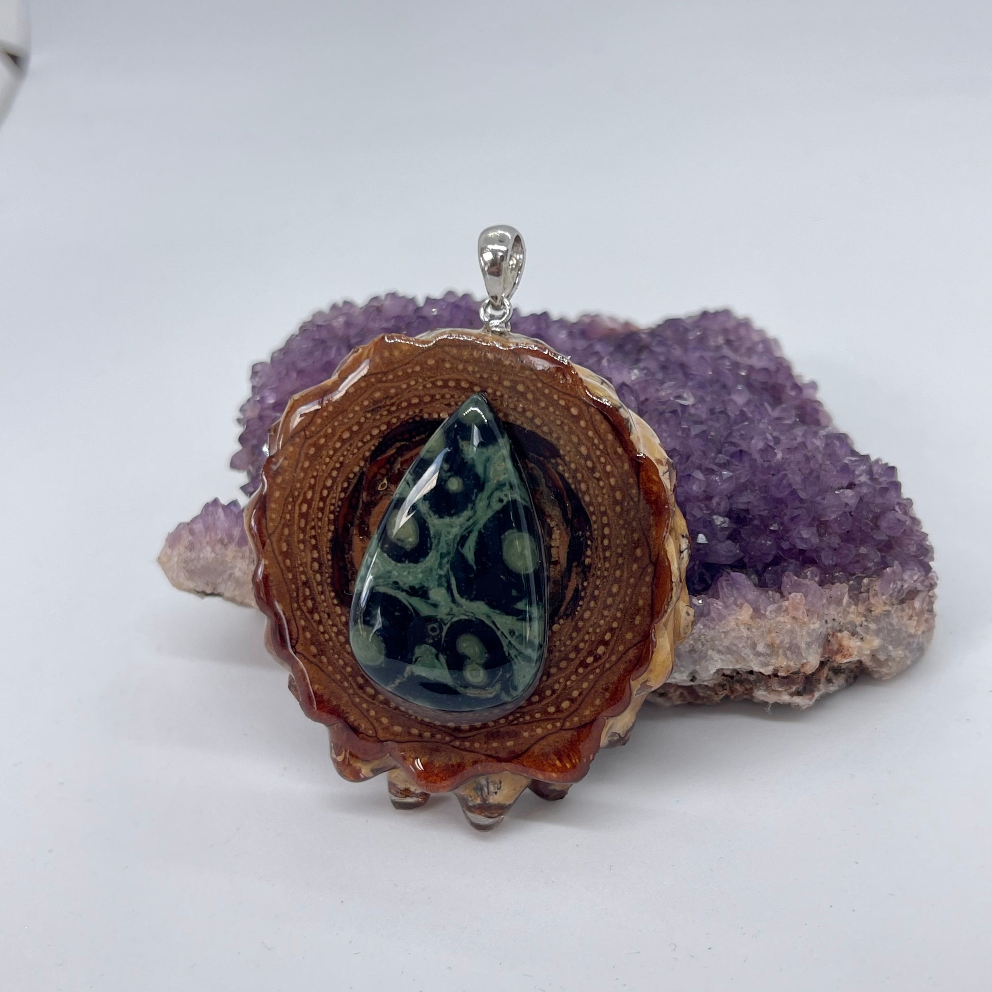 Sideview of pinecone pendant with Kambaba jasper gemstone and silver bail 