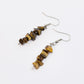tiger eye gemstone chip dangle earrings on white background
