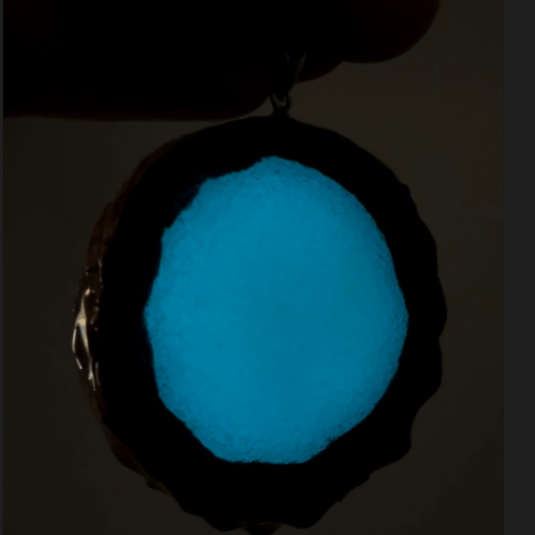 backside of glow in the dark pinecone pendant 