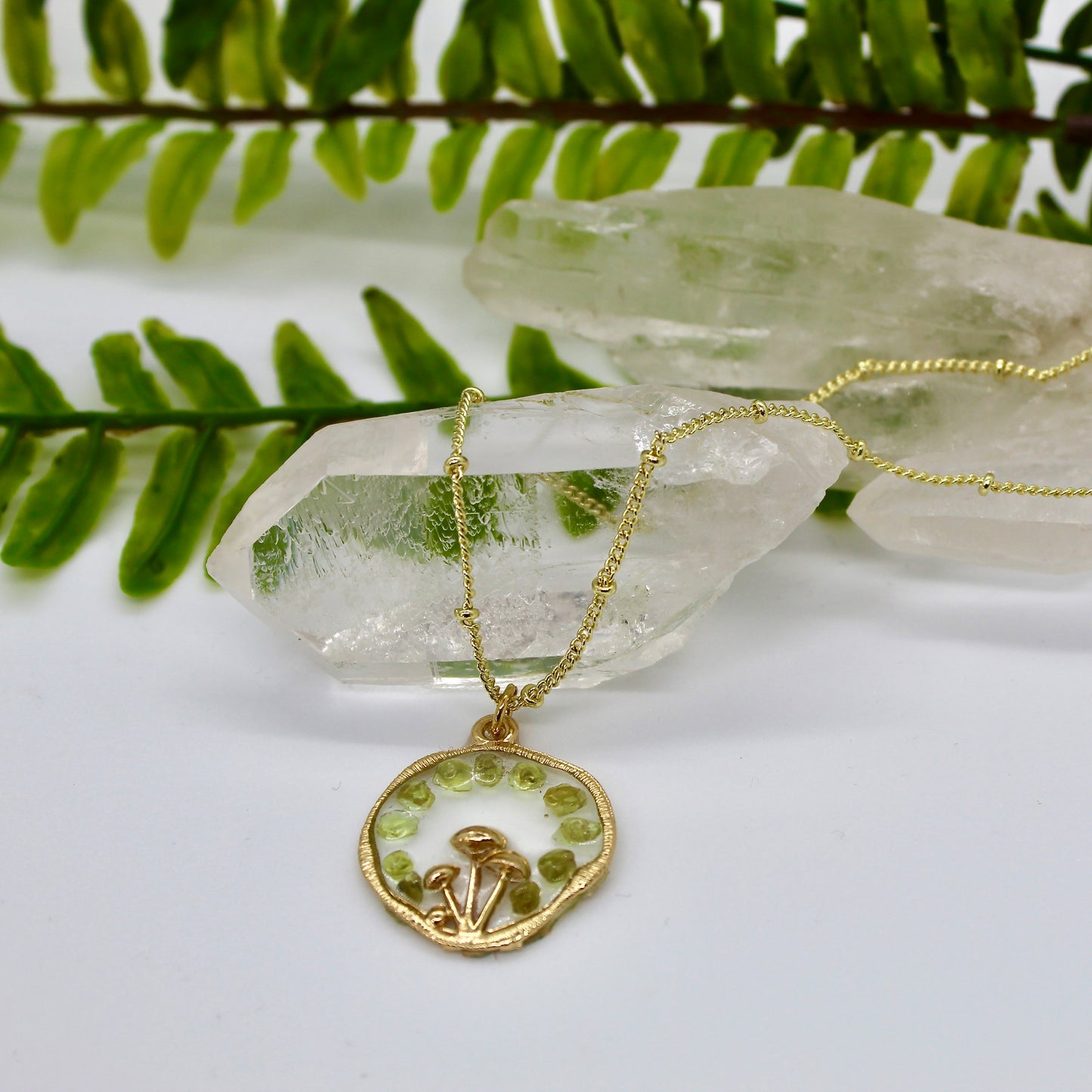 gold mushroom necklace with green cyrstal chips and gold chain